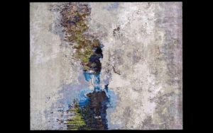 Dettaglio di tappeto moderno astratto grigio, azzurro e nero