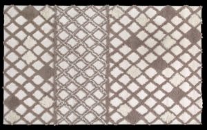 Dettaglio di tappeto moderno geometrico beige e marrone