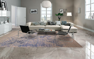 Tappeto moderno beige e blu con motivo geometrico in un soggiorno luminoso