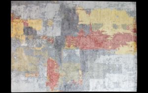 Dettaglio di tappeto moderno astratto grigio, rosso e giallo
