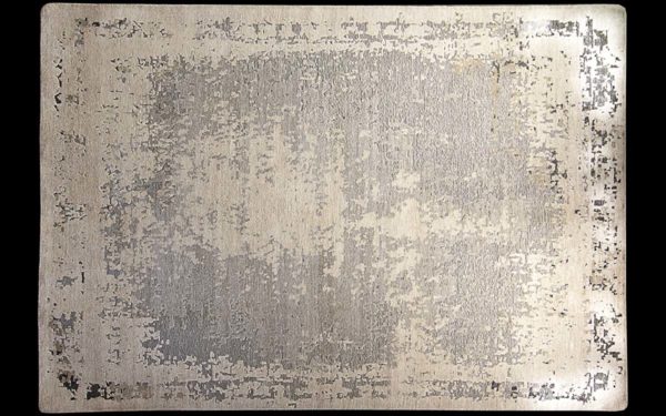Dettaglio di tappeto moderno grigio e beige dall’effetto vissuto