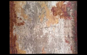 Dettaglio di tappeto moderno astratto grigio, crema, ocra e bordeaux