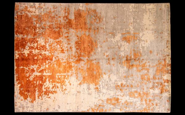 Dettaglio di tappeto moderno astratto arancione e grigio