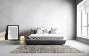 Tappeto moderno beige e grigio con motivo classico in una camera minimalista