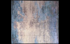 Dettaglio di tappeto moderno astratto azzurro, lilla e crema